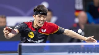 Tischtennisspieler Dang Qiu in Aktion
