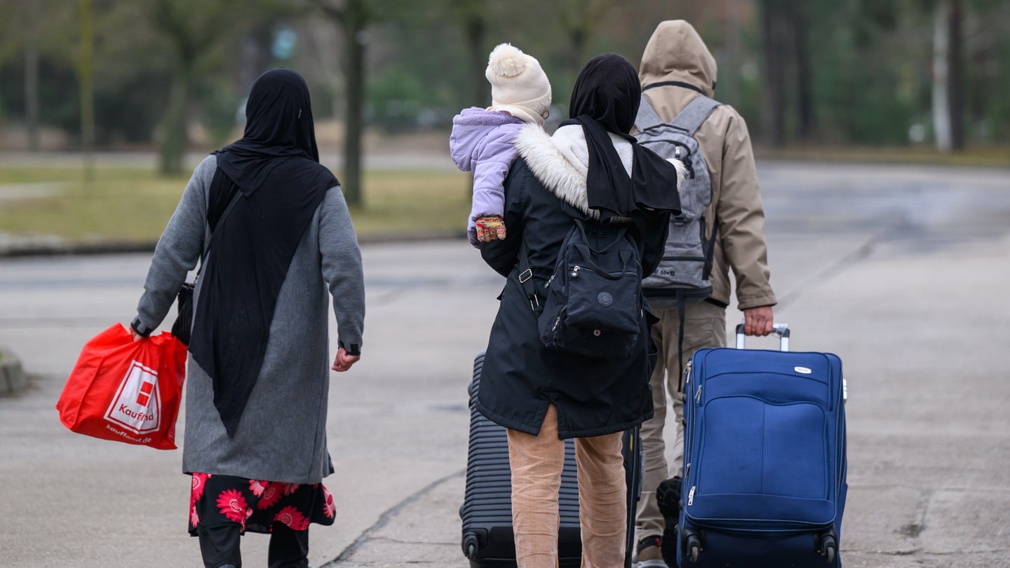 Migranten mit Reisegpäck